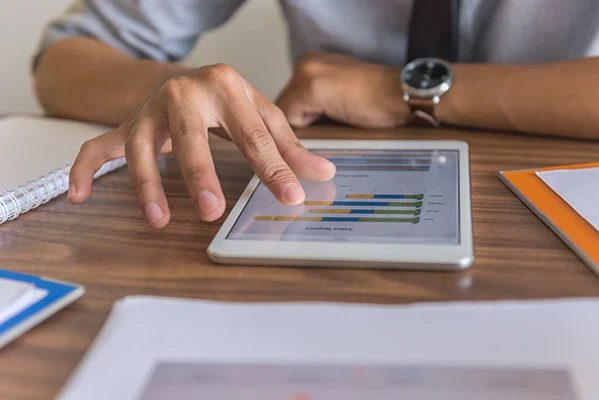 Compliance manager reviewing a year-end checklist on a digital dashboard